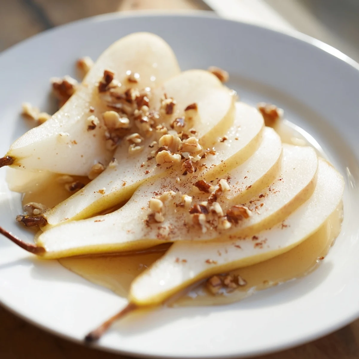 Thinly sliced pears with a glistening honey drizzle, inviting you for a light and sweet bite.