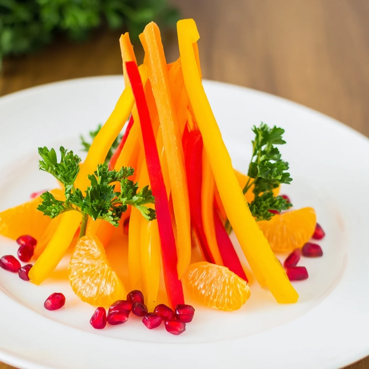 Bonfire Warmth Centerpiece: Vibrant arrangement of carrot, pepper, and mandarin, mimicking a bonfire's inviting glow.