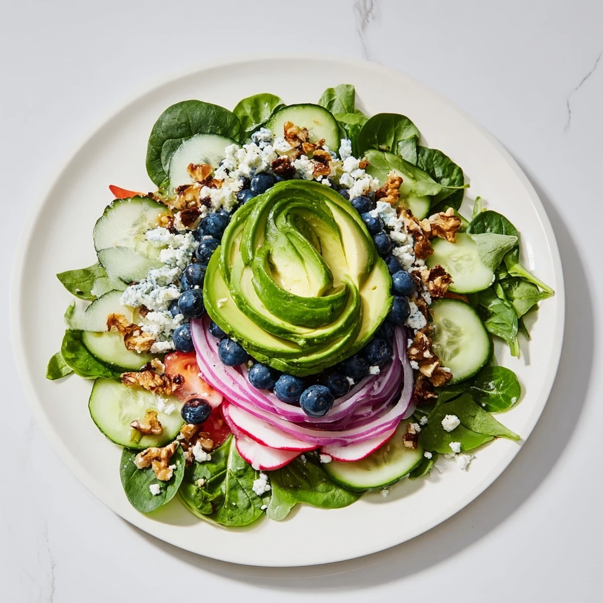 Vibrant Fibonacci Fan Salad, featuring fresh greens, colorful veggies, and creamy avocado, ready to serve.