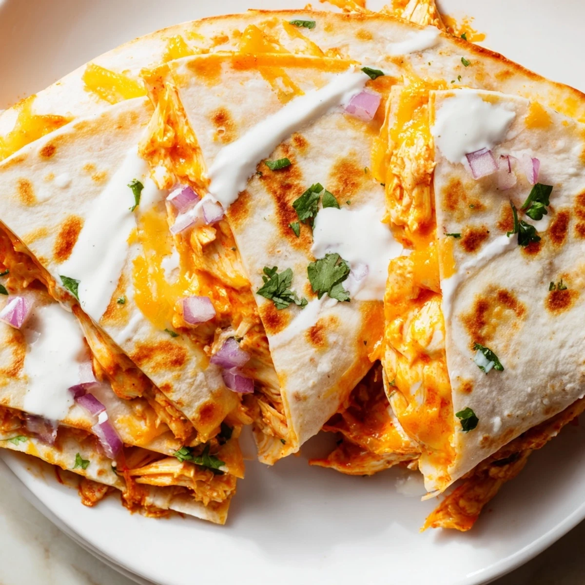 Spicy aroma of a freshly made Buffalo Chicken Quesadilla, featuring melted cheese and a crispy tortilla.