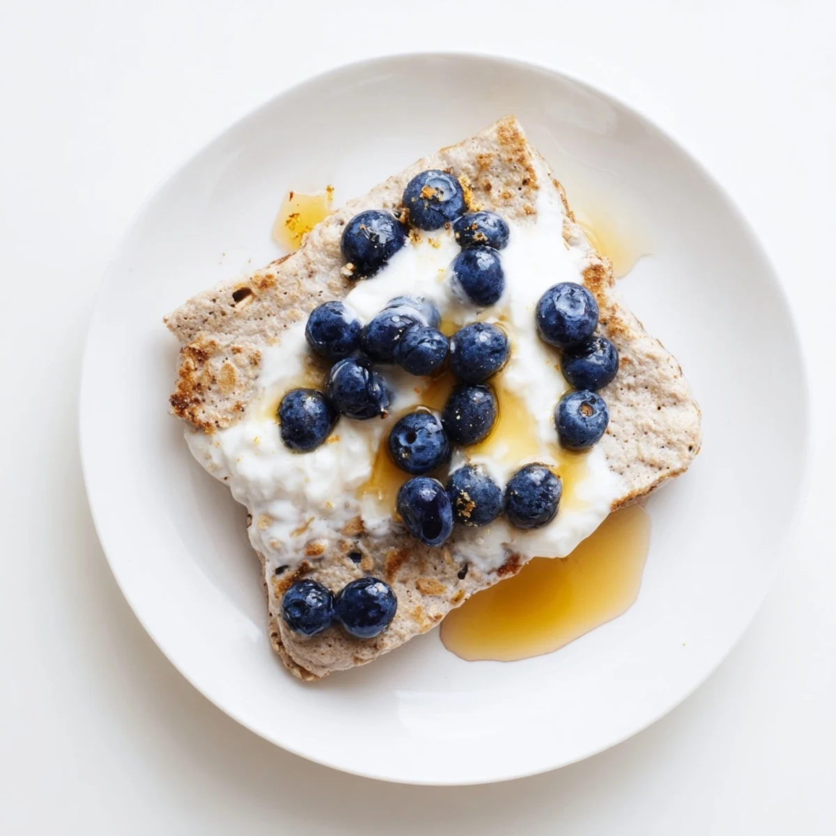 Fluffy Protein Pancake Oats, baked until golden, ready to be sliced and enjoyed for breakfast.