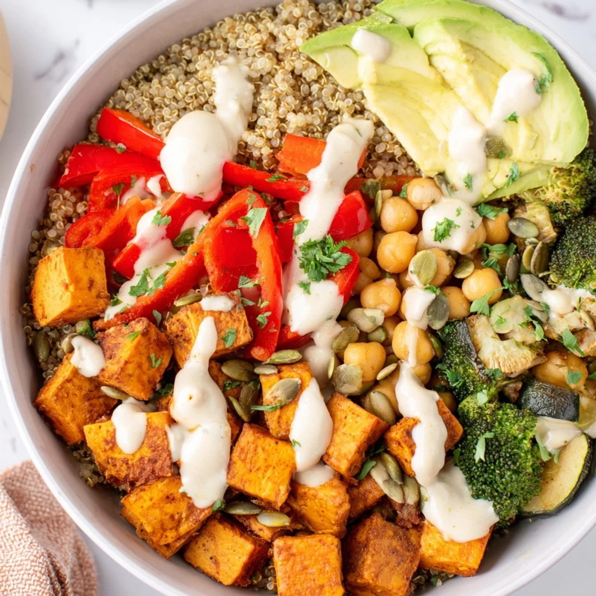 A nutritious Quinoa Buddha Bowl, artfully arranged with roasted veggies and savory chickpeas.