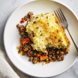 Creamy mashed potato peaks atop a rich, savory Warm Rustic Shepherds Pie bake.