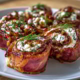 Creamy cheese, smoky ham, and crisp pickles rolled into easy, bite-sized pinwheels—ideal for holiday gatherings or potlucks.