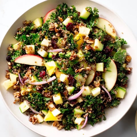 A colorful bowl of Light Wild Rice and Cranberry Salad, bursting with fresh, forest-inspired flavors.