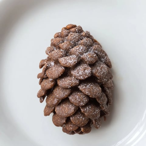 Pinecone nut butter snacks arranged on a tray, ready to delight with their textured surfaces and sweet aroma.