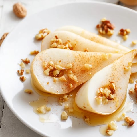 Golden-hued pear slices with honey drizzle, a simple, elegant snack for any occasion.