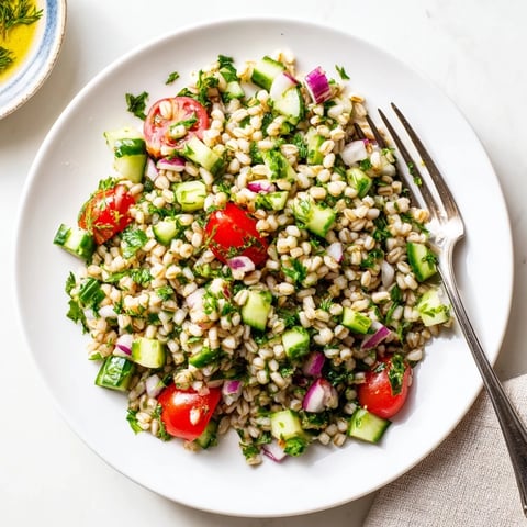 Vibrant Mediterranean Barley and Herb Salad featuring chewy pearl barley tossed with fresh parsley, mint, and dill in a zesty lemon vinaigrette.