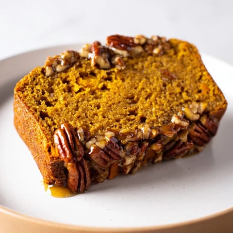 Warmly spiced Weekend Cabin-Style Sweet Potato and Pecan Loaf, studded with toasted pecans ready to eat.