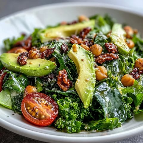 Fresh Mixed Greens Power Bowl layered with spinach, arugula, avocado, tomatoes, and crunchy walnuts.