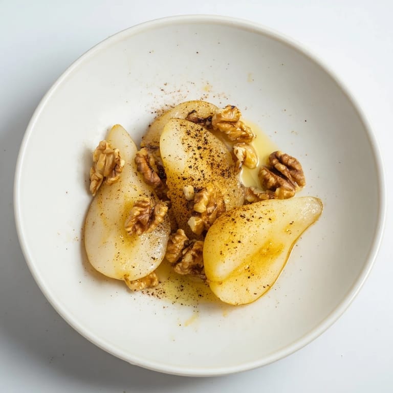 Warm Maple-Warm Cozy Plate: A close-up of tender, caramelized pears and walnuts in a bubbling, bubbly bake.