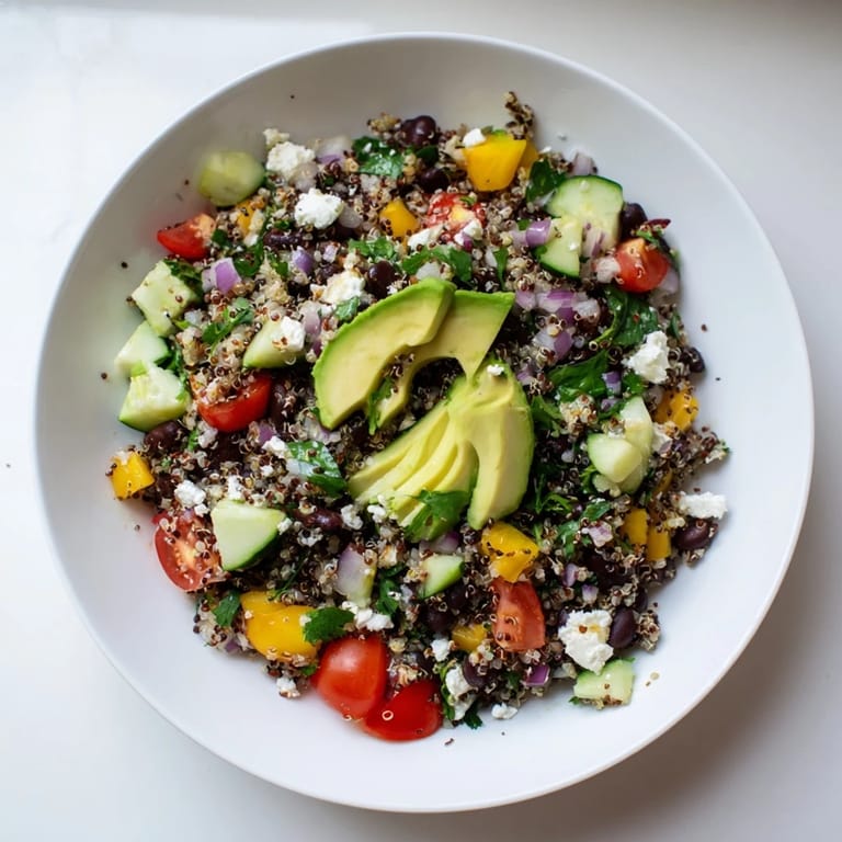Enjoy the delicious Poppy-Bright Colorful Quinoa and Black Bean Salad, a healthy and filling lunch option.