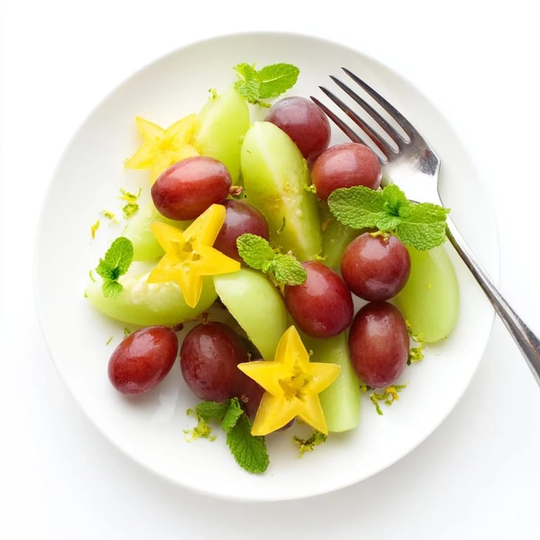 Healthy brunch fruit plate: showcasing ripe starfruit and grapes, bursting with flavor for a light and tasty treat.