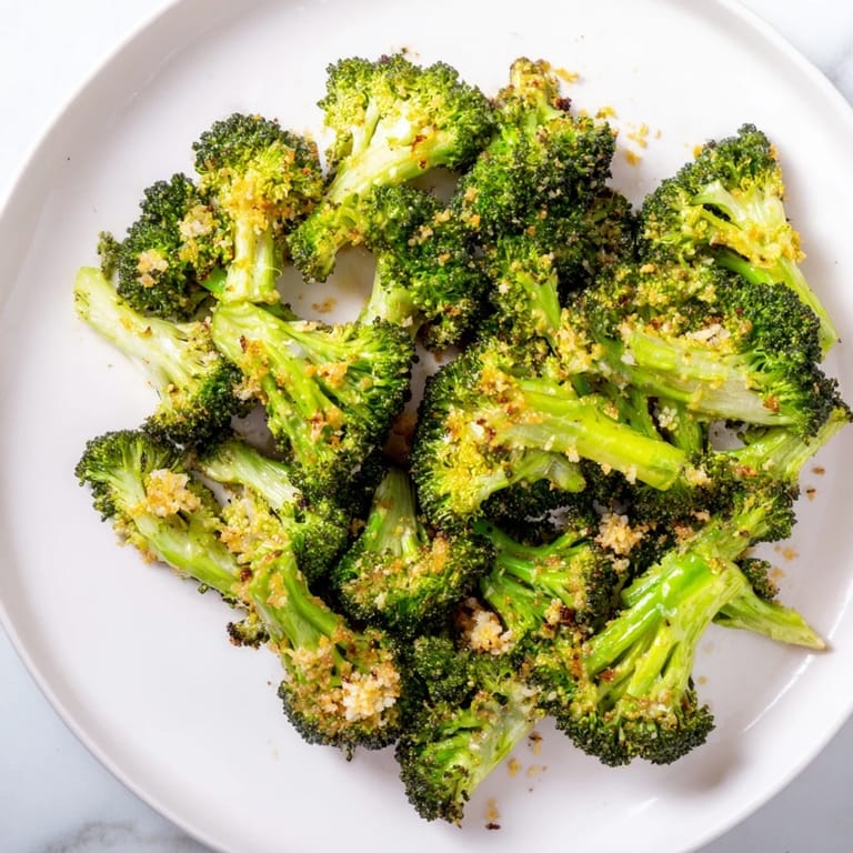 Tender-crisp Lemon Garlic Roasted Broccoli, seasoned with garlic, offers a bright and savory side.