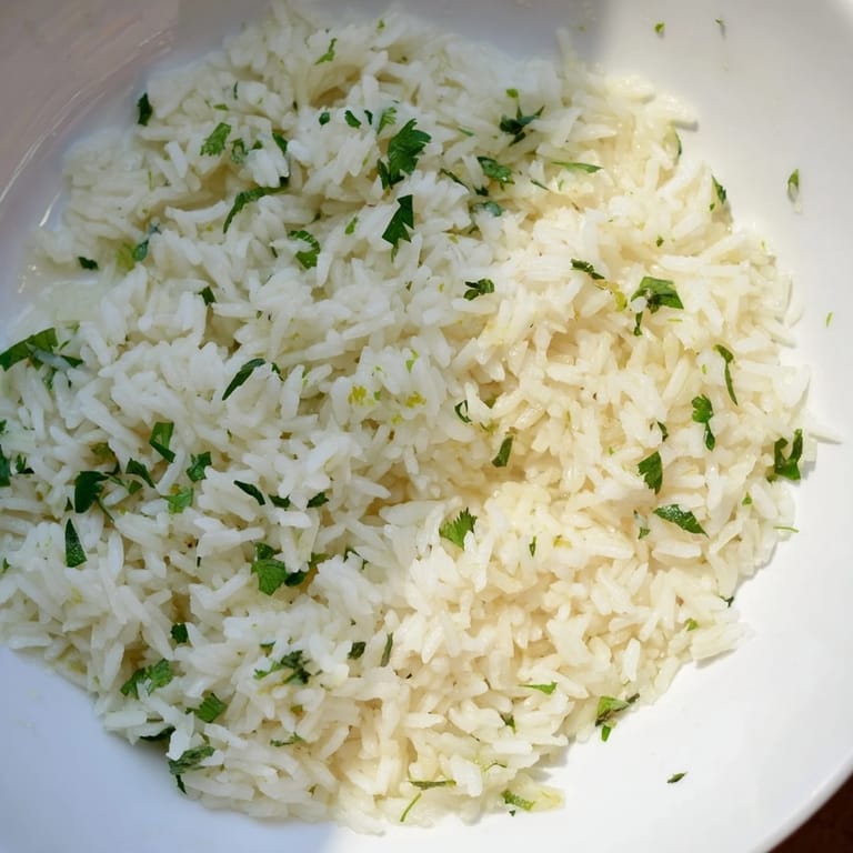 Warm cilantro lime rice in a serving bowl, perfectly paired alongside grilled chicken or tacos.