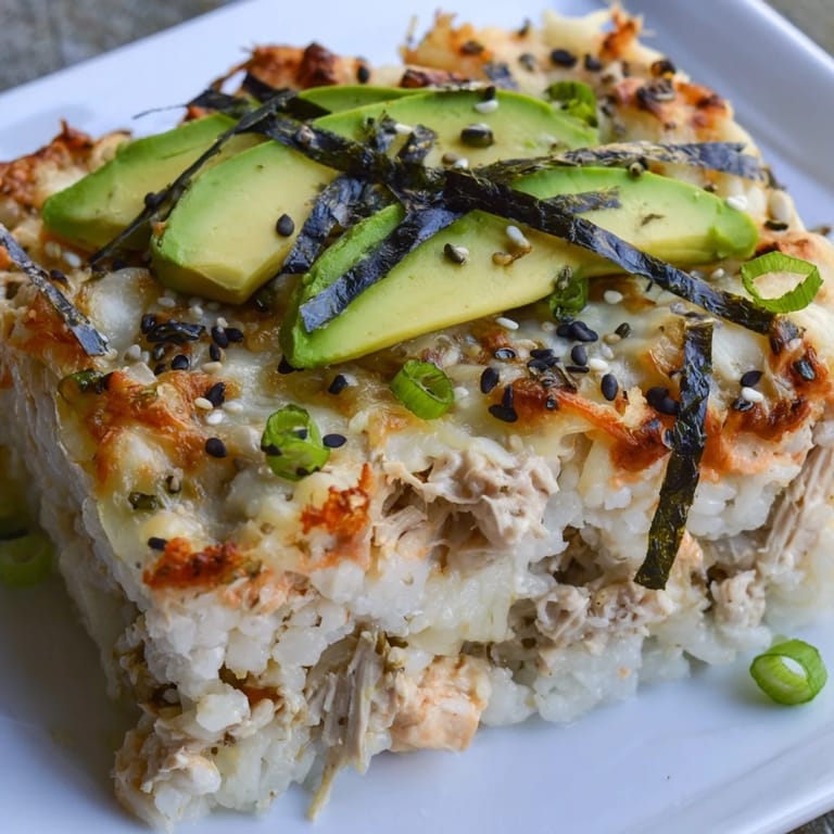 This Chicken Sushi Bake shows tender chicken and rice, topped with melted cheese, ready to serve.