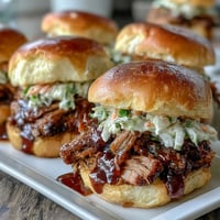 Tender BBQ baby shower brisket sliders on soft buns with smoky pulled brisket and tangy slaw.  