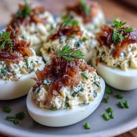 Smoked Salmon Deviled Eggs with Everything Seasoning: Creamy, savory bites topped with crunchy everything bagel seasoning for a brunch favorite.